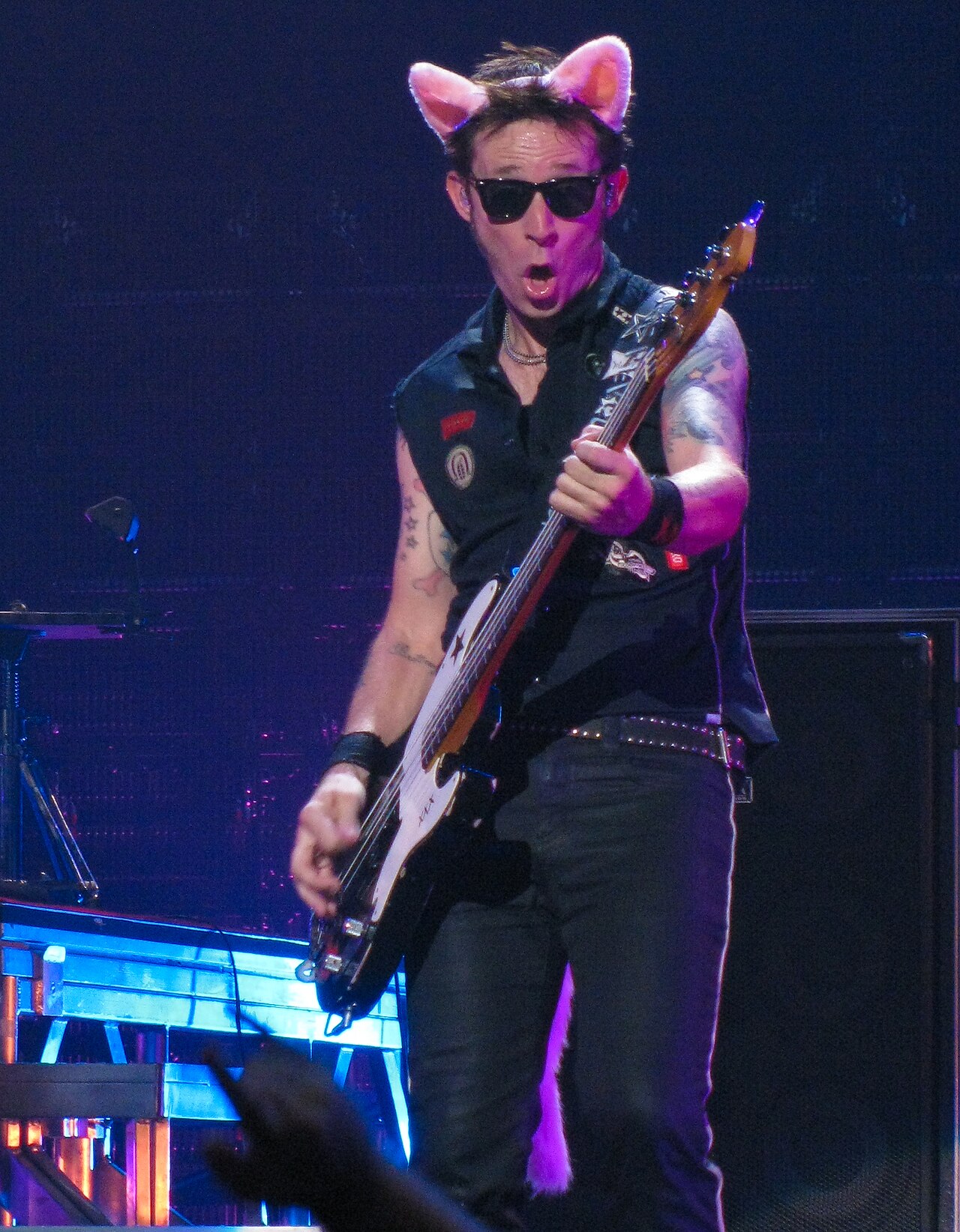 Mike Dirnt colorful arm tattoos while playing bass