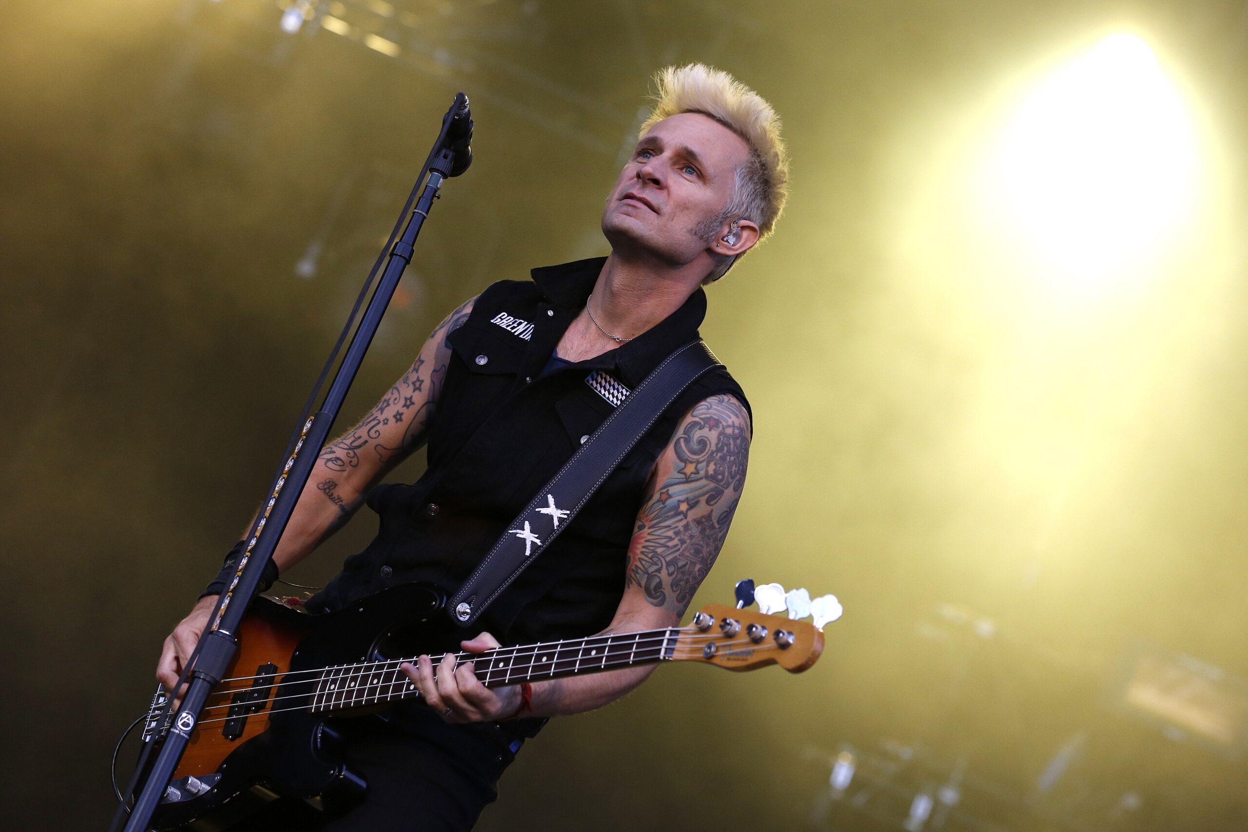 Mike Dirnt right arm script and star tattoos