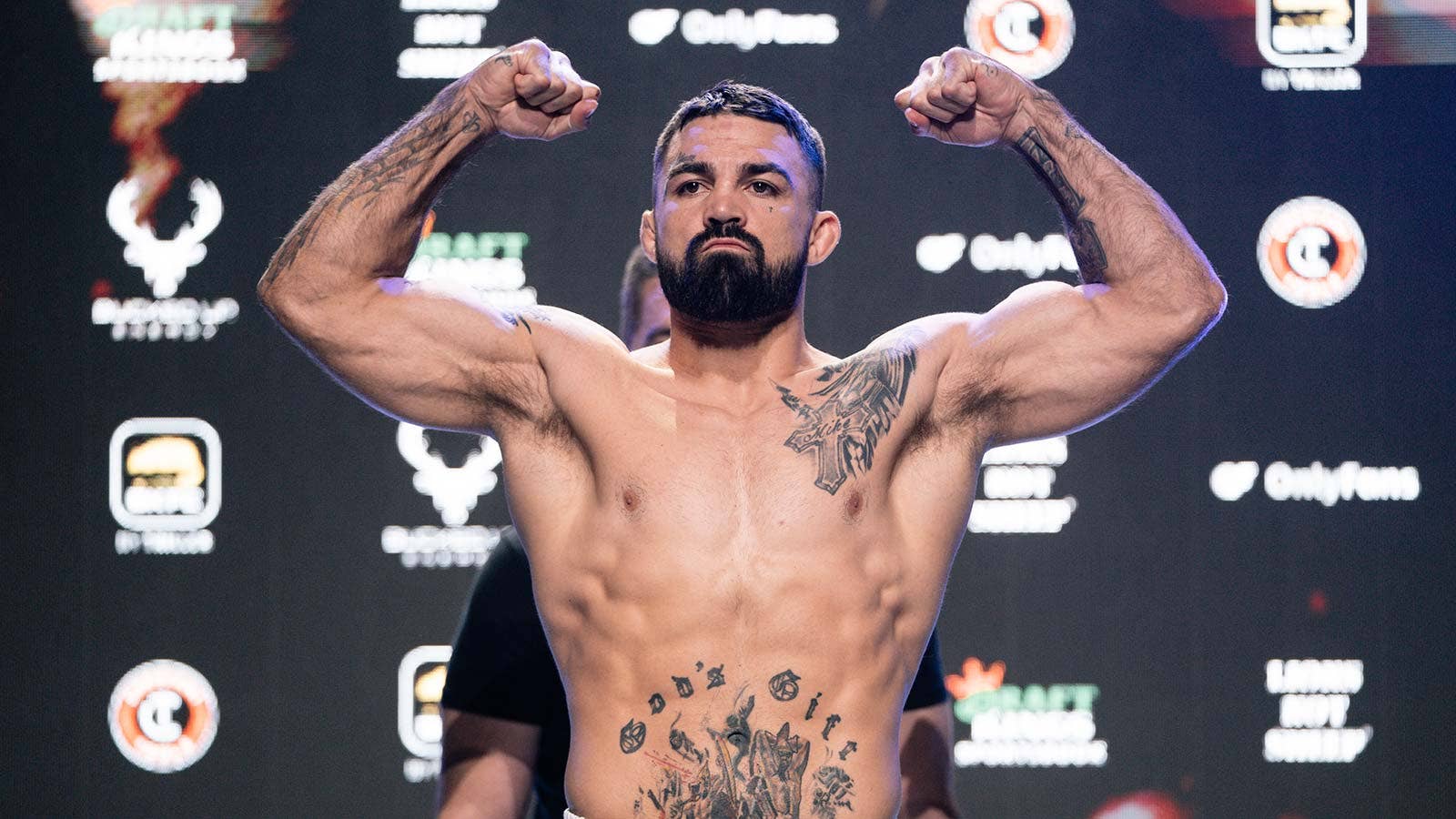 Mike Perry showing his Relentless forearm tattoo