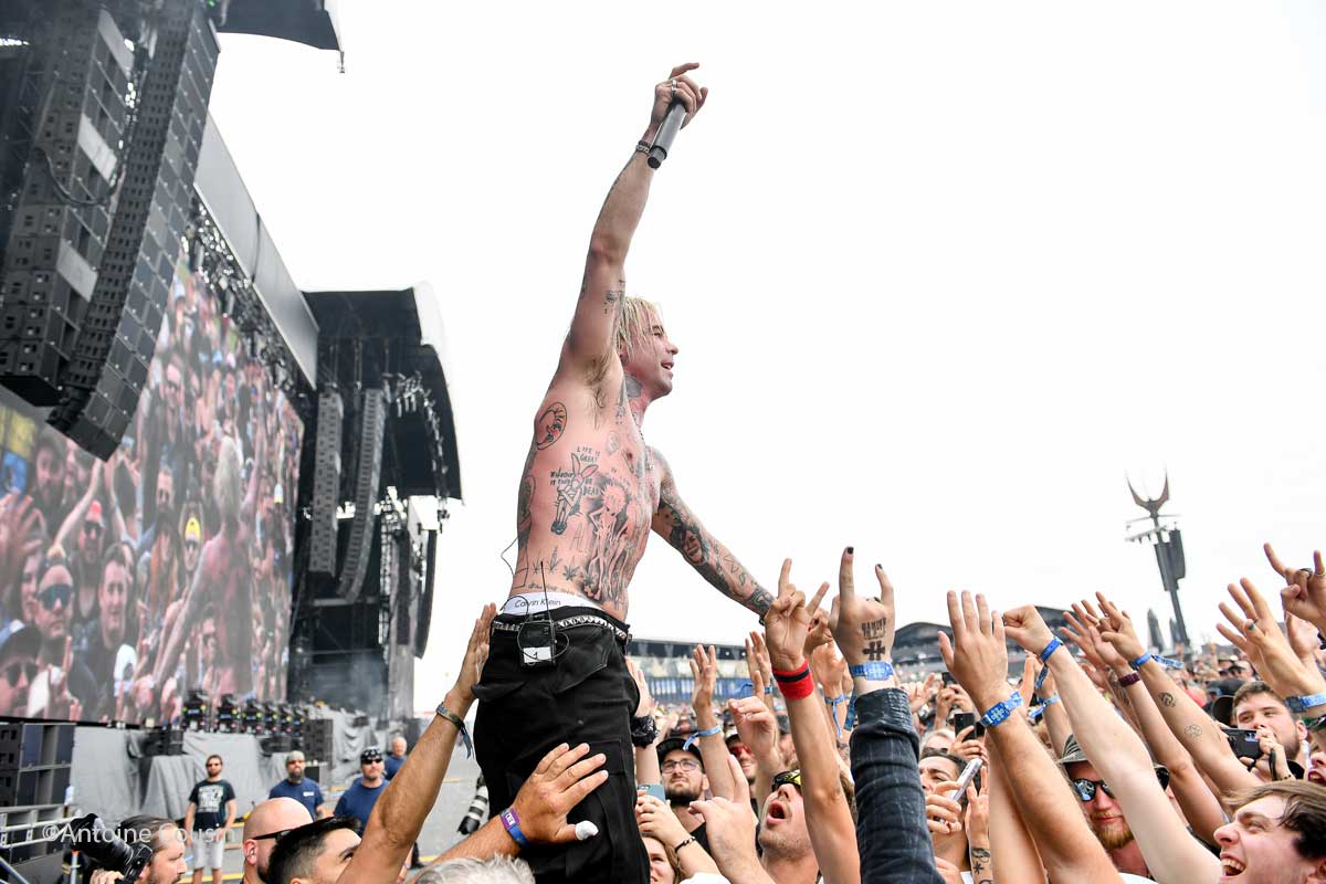Mod Sun tattoos: torso and arm tattoos visible during a Hellfest performance