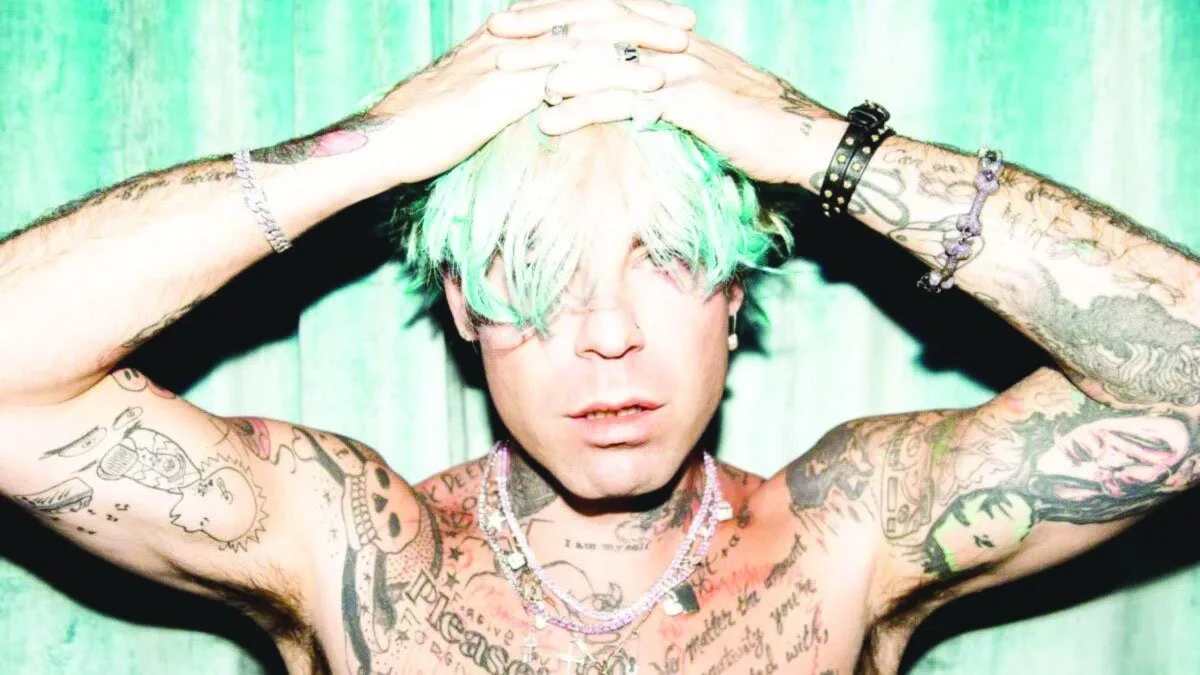 Mod Sun tattoos: full chest, neck and forearm tattoo layout in a shirtless portrait
