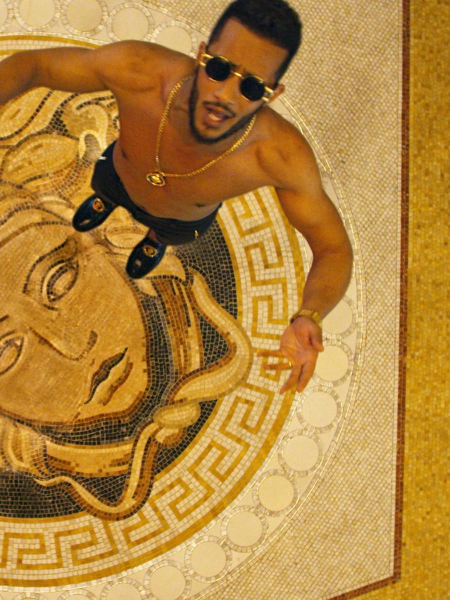 Mohamed Ramadan in a contextual photograph: Contextual only: separate fashion/performance portrait; not tattoo evidence.; not tattoo evidence