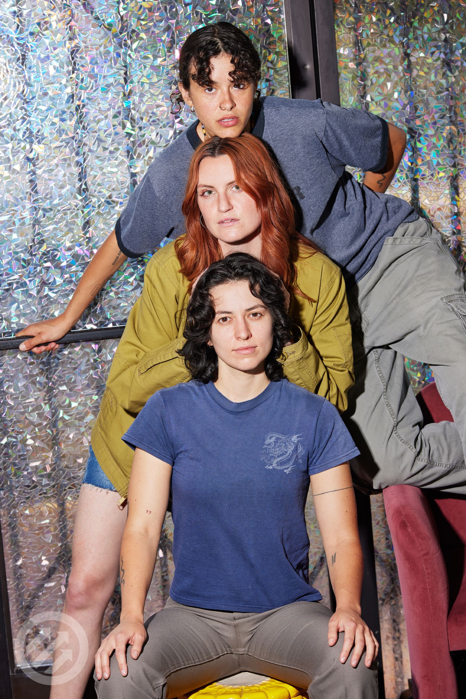 MUNA Close portrait showing the three fresh 7.7 tattoos on different members MUNA tattoos: Close portrait showing the three fresh 7.7 tattoos on different members