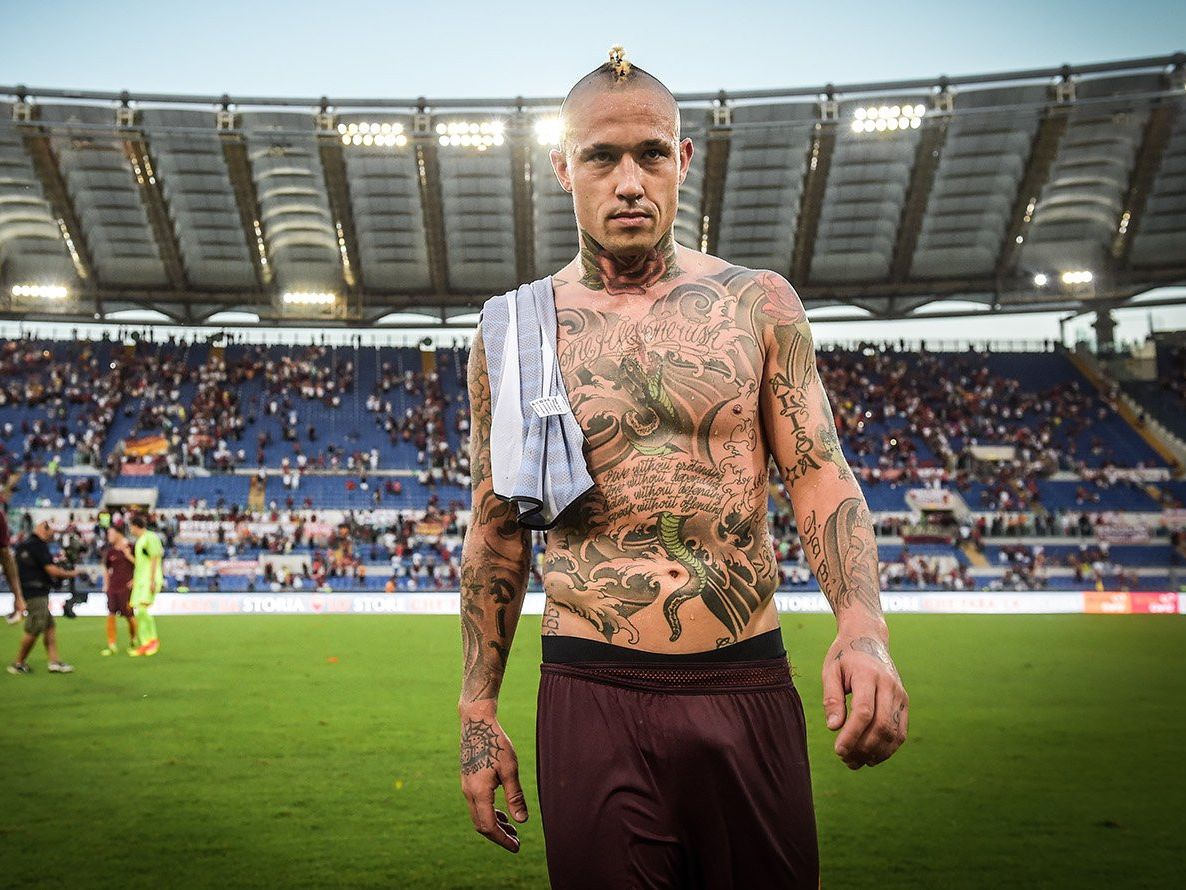 Radja Nainggolan full torso and arm tattoos after a match