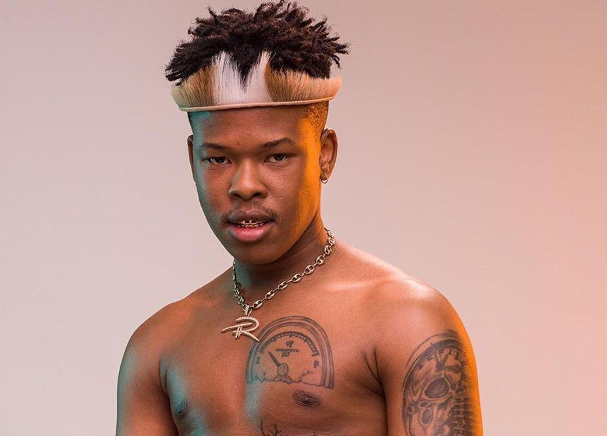 Nasty C tattoos: chest, shoulder and upper-arm tattoos in a high-resolution shirtless portrait