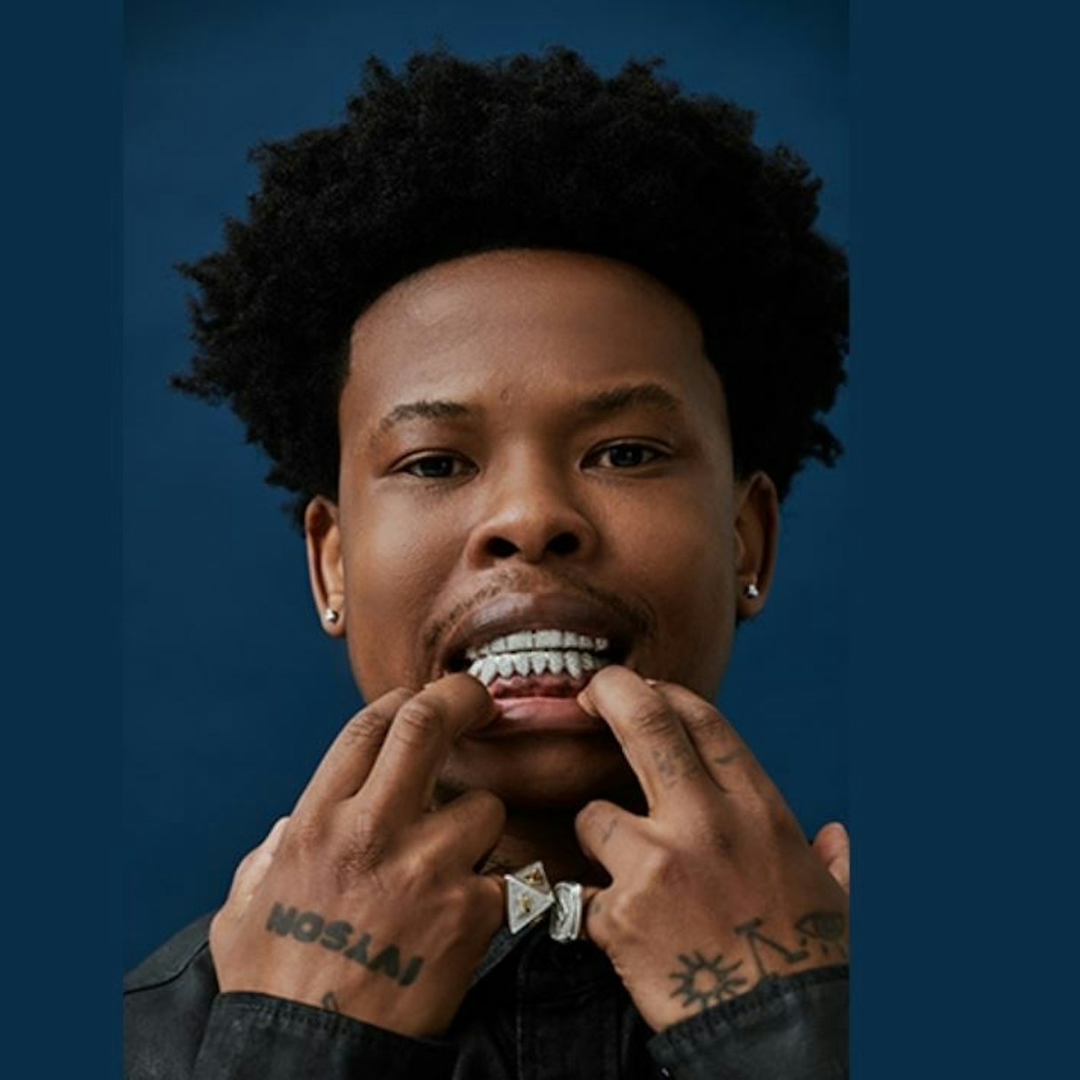 Nasty C tattoos: hand and finger tattoos shown beside the face and grill