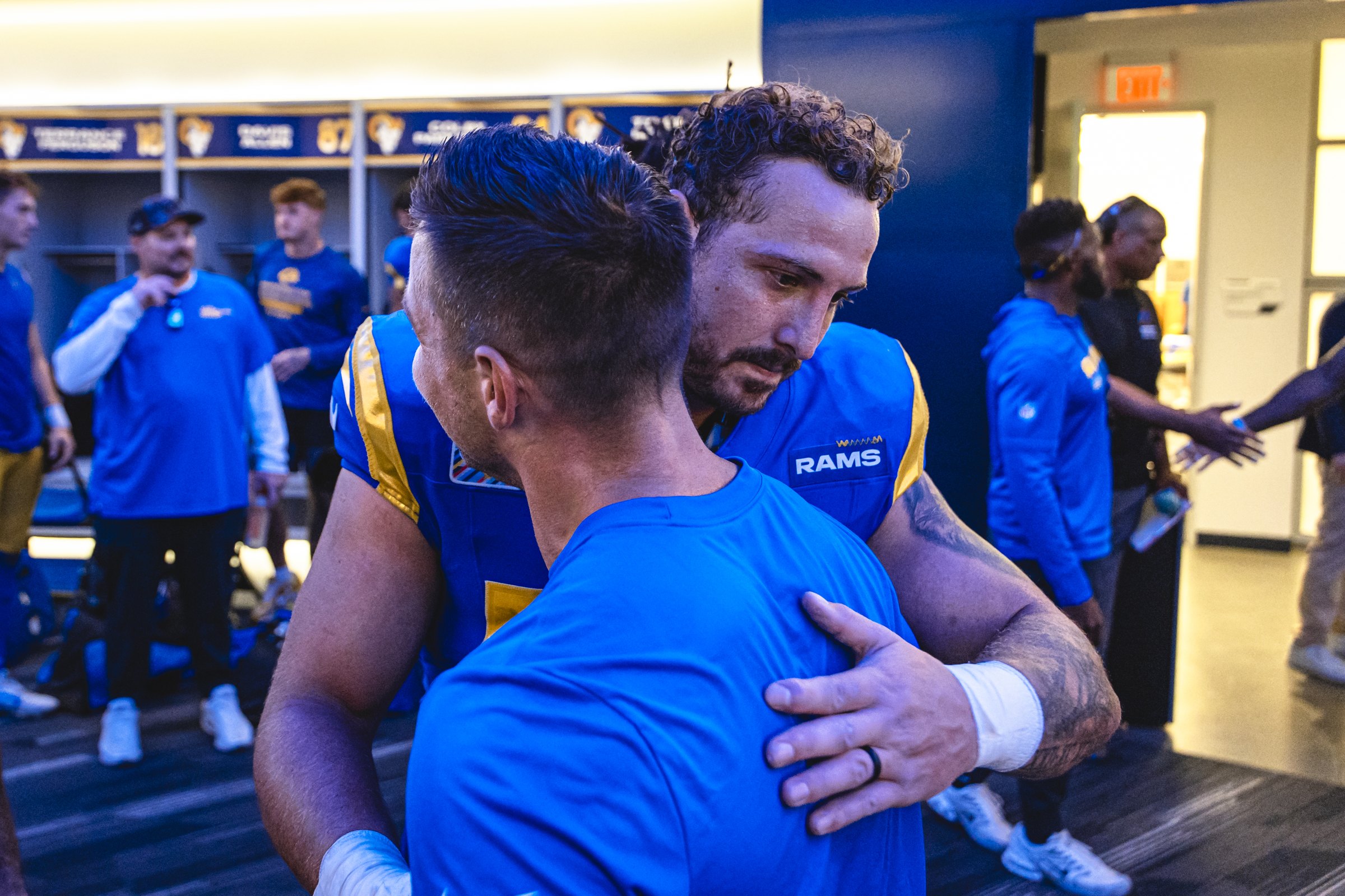 Nate Landman tattoos in Rams action photograph Nate Landman tattoos: game photograph showing the tattooed arm and upper-body placement in a separate Rams setting
