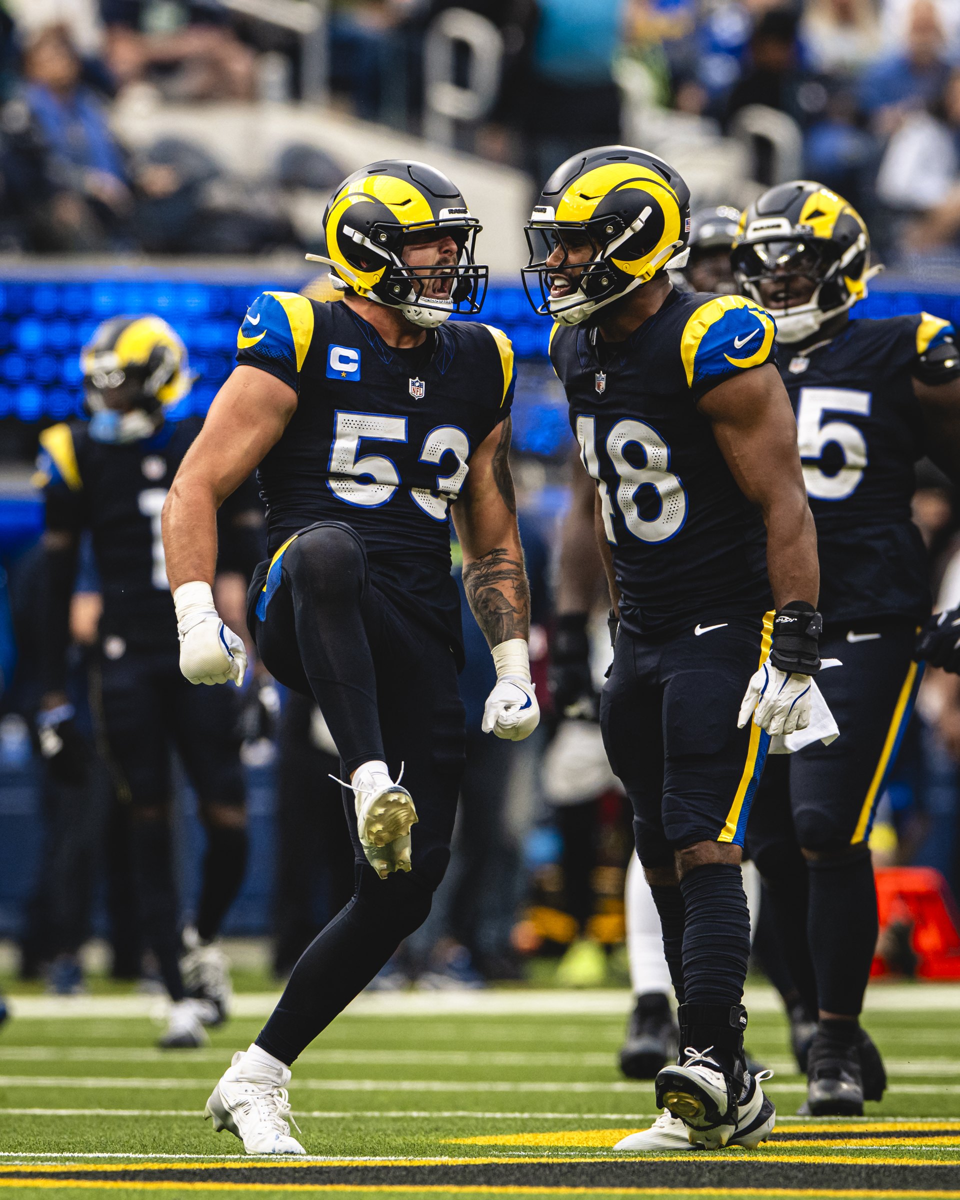 Nate Landman tattooed arm in Rams game photo Nate Landman tattoos: high-resolution Rams game photograph showing tattooed arms in motion beneath the uniform