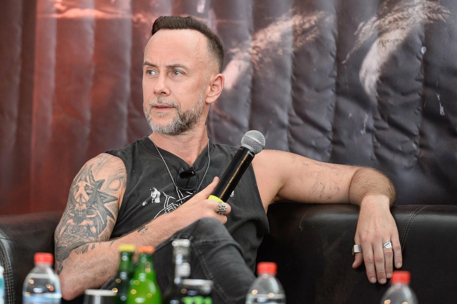 Nergal upper arm tattoos in interview