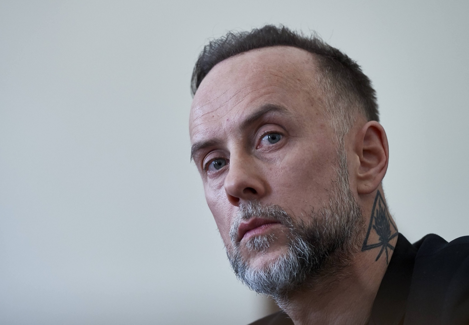 Nergal geometric neck tattoo close-up