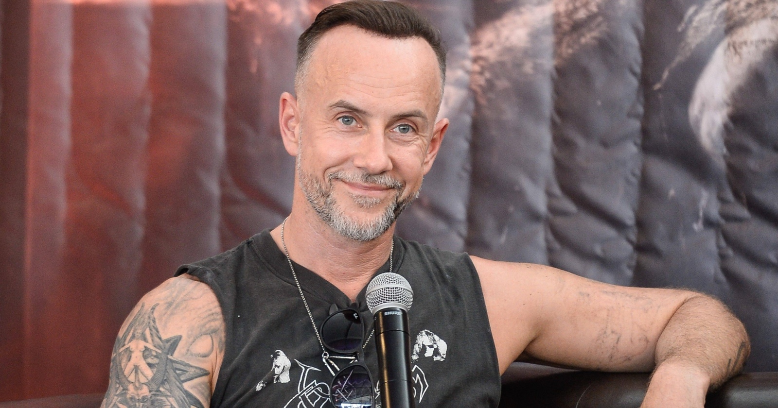 Nergal shoulder and upper arm tattoos