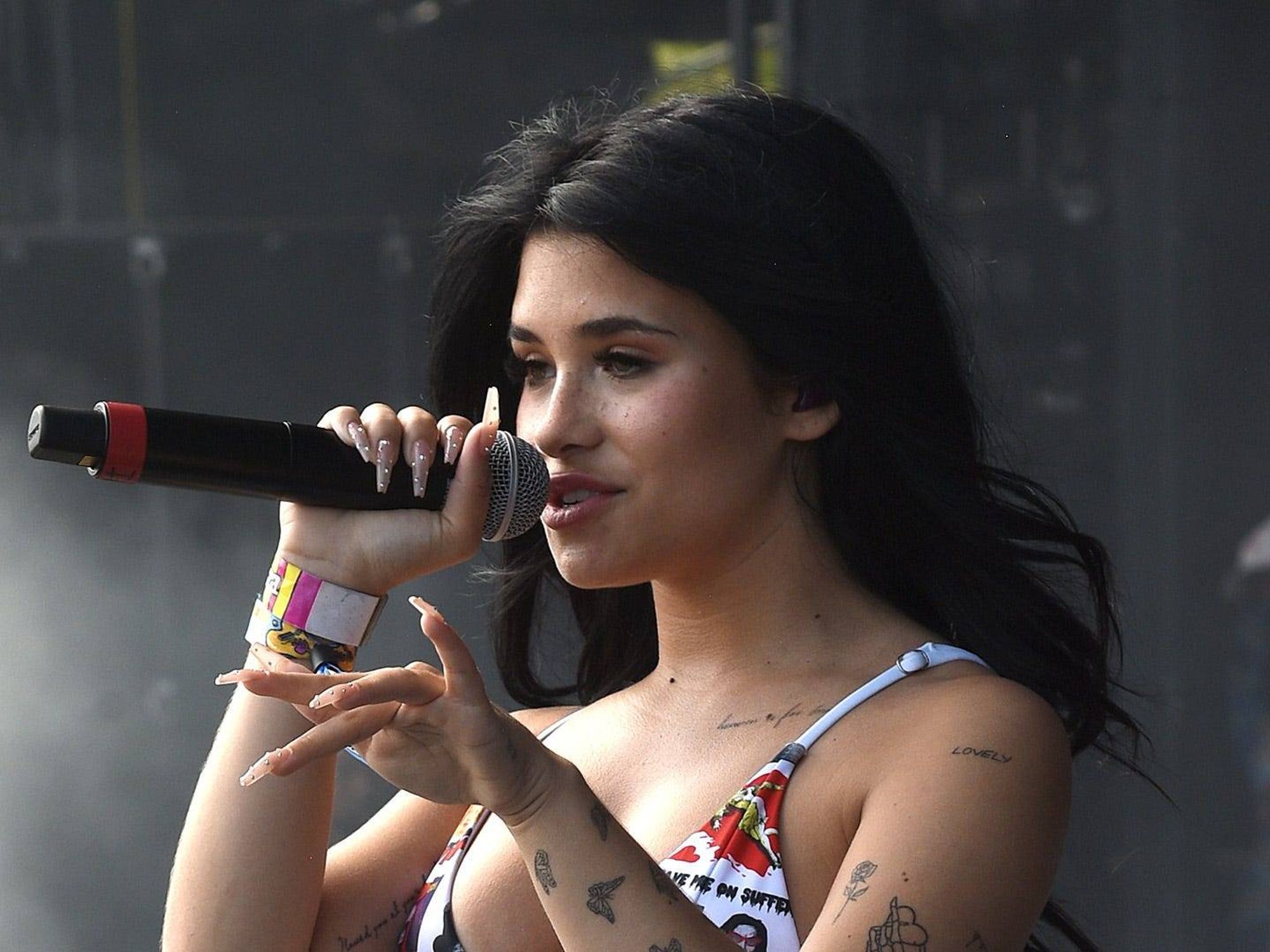 Nessa Barrett tattoos: butterflies, floral outlines, and shoulder symbols