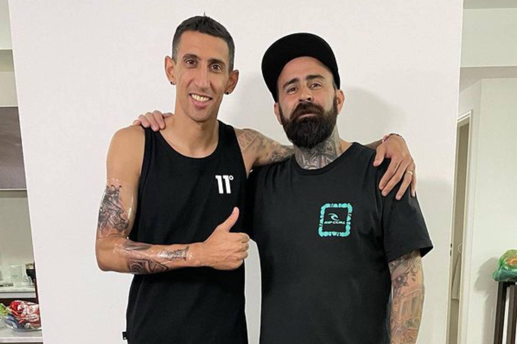 Ángel Di María right-arm stickers, Rosario and Madrid lettering, Bart Simpson Ángel Di María tattoos: right-arm stickers, Rosario and Madrid lettering, Bart Simpson
