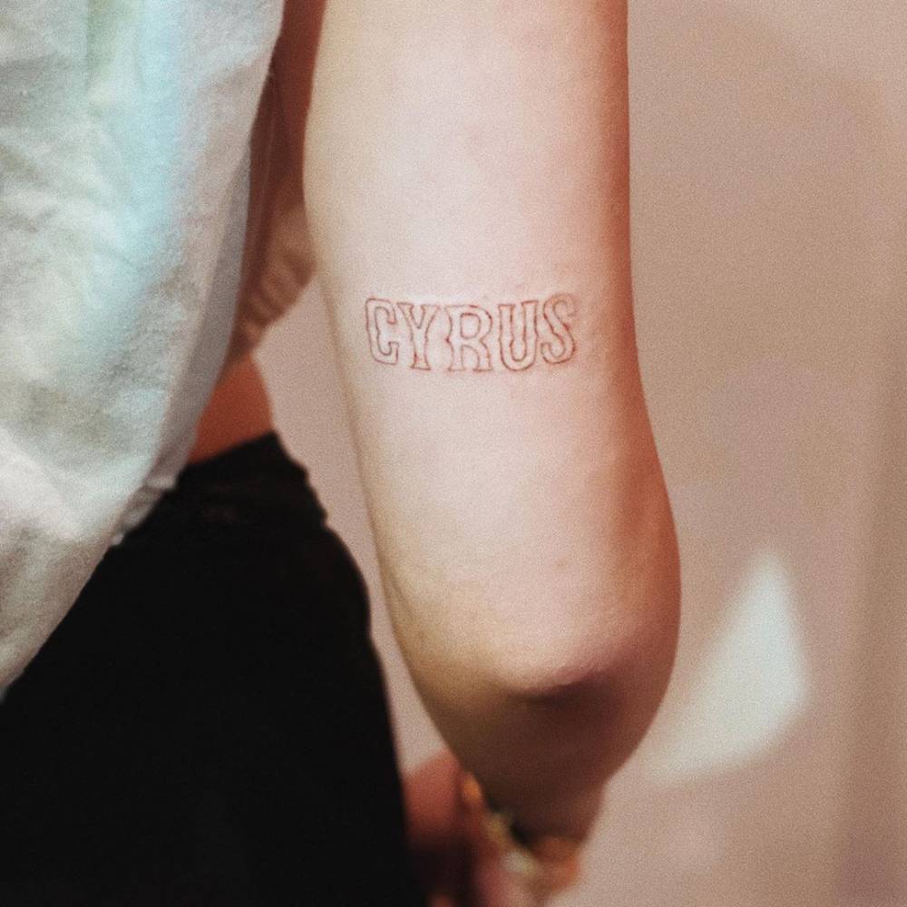 Noah Cyrus CYRUS family name tattoo