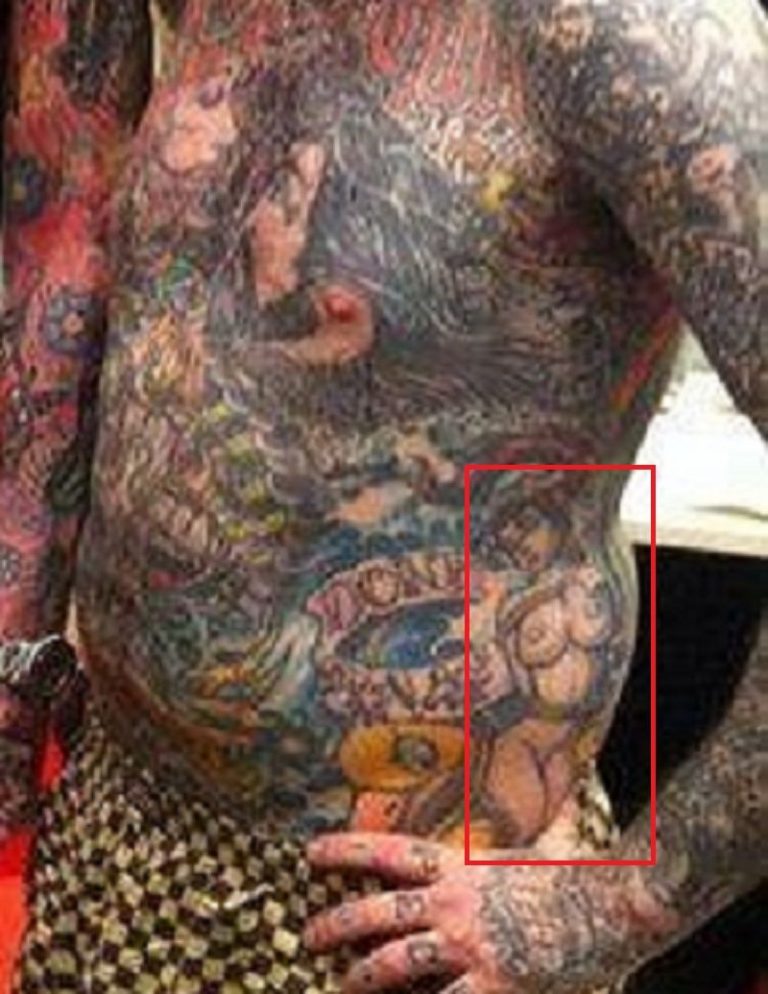 Oliver Peck tattoos: body photograph showing Oliver Peck tattoos relevant to oliver peck's chest tattoos combine lettering and large figures