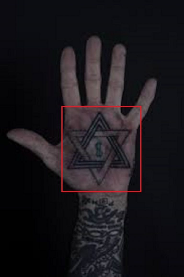 Oliver Peck tattoos: body photograph showing Oliver Peck tattoos relevant to oliver peck's hand tattoos remain visible in convention photographs