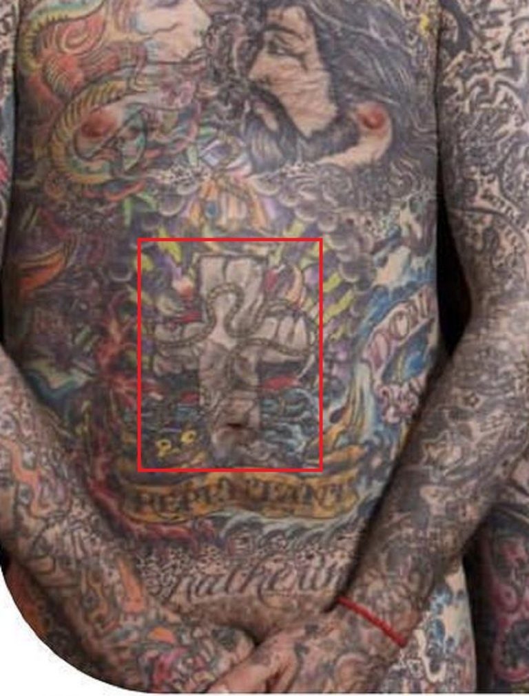 Oliver Peck tattoos: body photograph showing Oliver Peck tattoos relevant to oliver peck's torso tattoo coverage shows the collection's colour and density