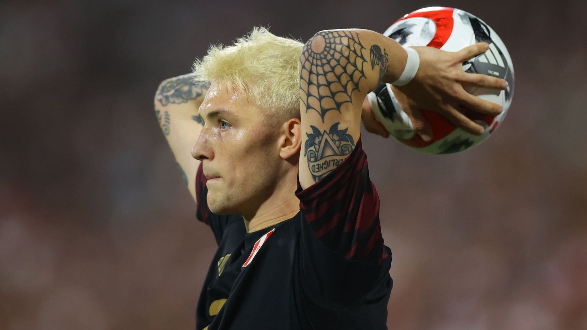 Oliver Sonne in a contextual photograph: contextual photograph, explicitly not tattoo evidence; not tattoo evidence