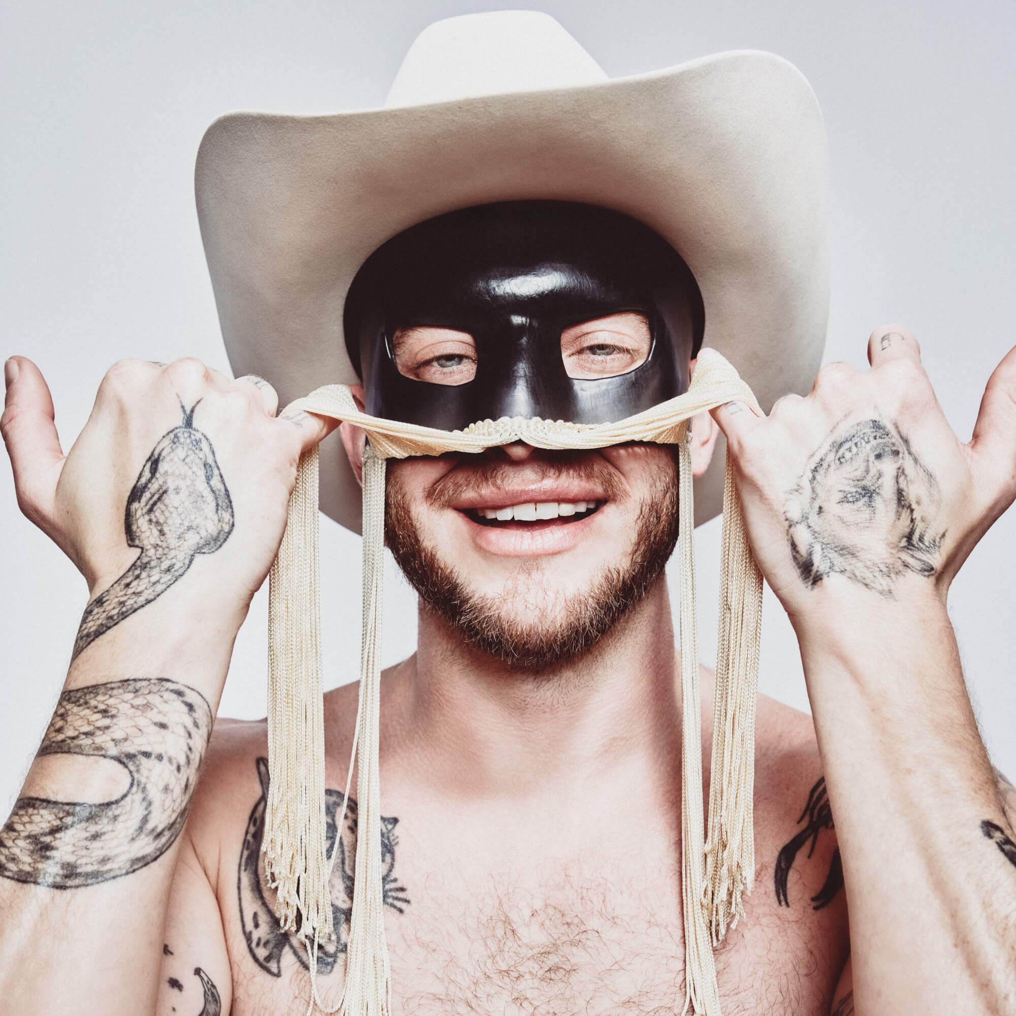 Orville Peck tattoos: close body photograph showing the animal collection