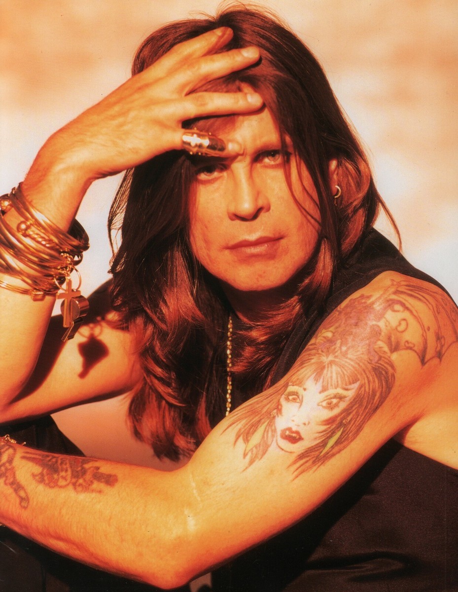 Ozzy Osbourne tattooed arms and hand ink visible in a 1995 portrait