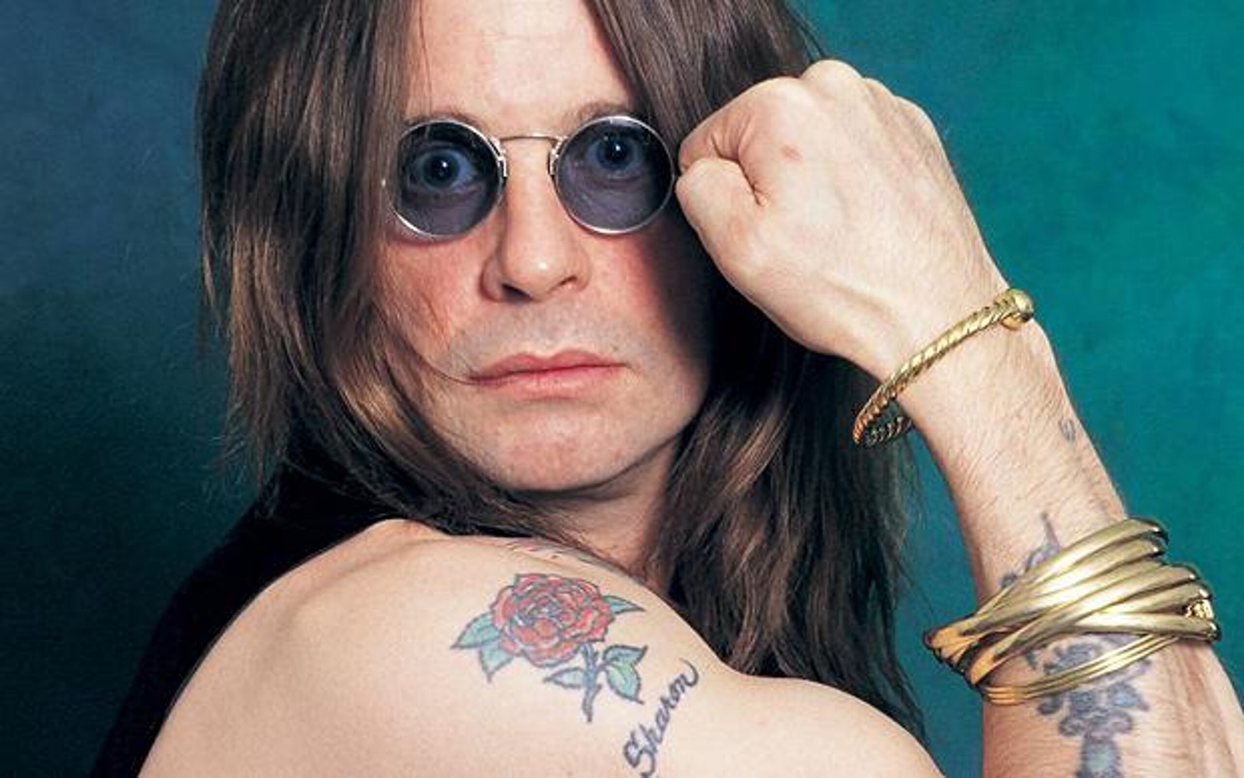 Ozzy Osbourne Sharon rose shoulder tattoo and forearm ink