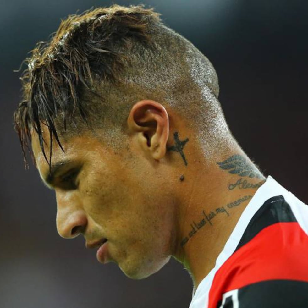 Paolo Guerrero tattoos: neck script and behind-ear details
