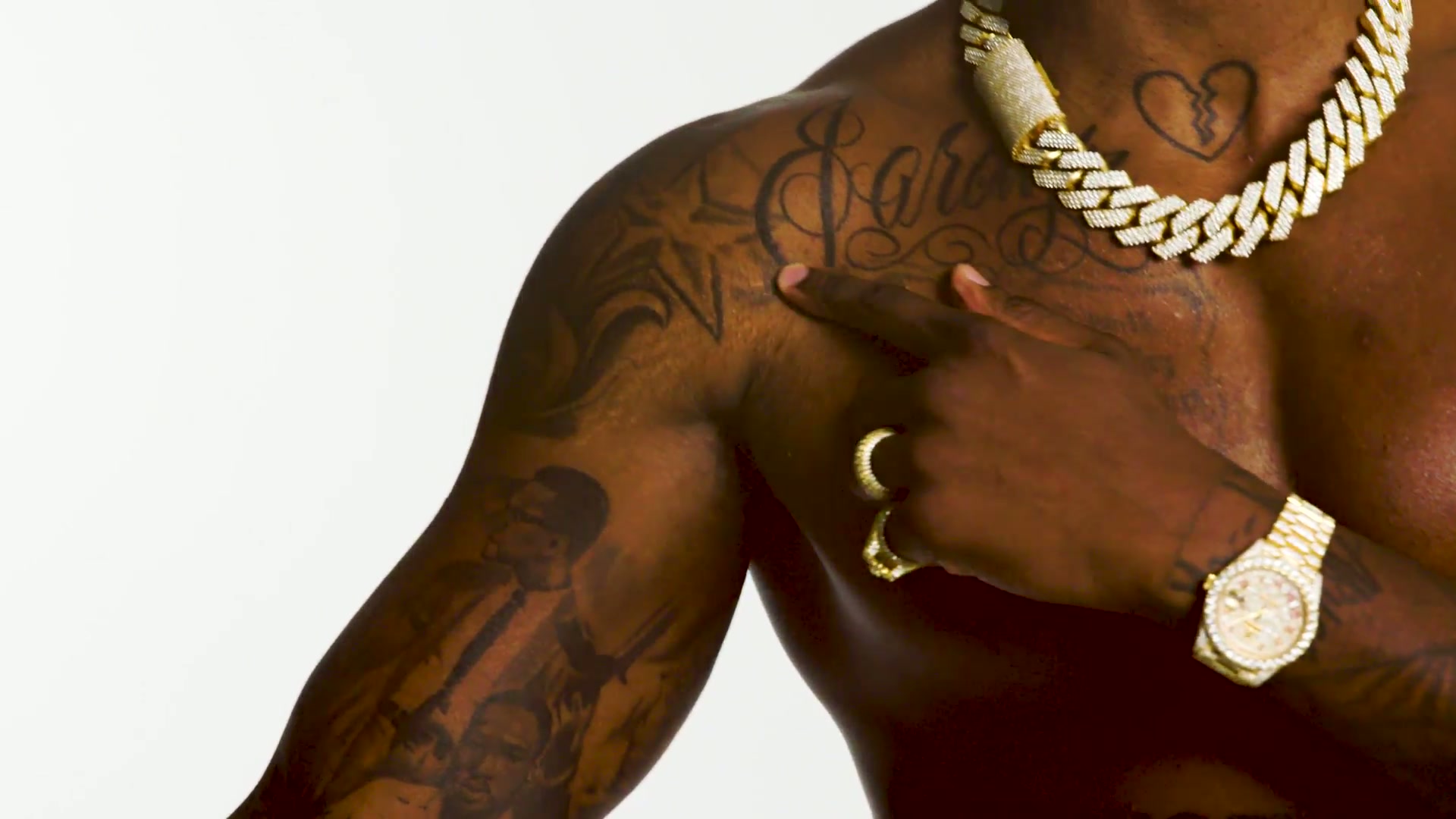 Chest tattoos including the broken heart design