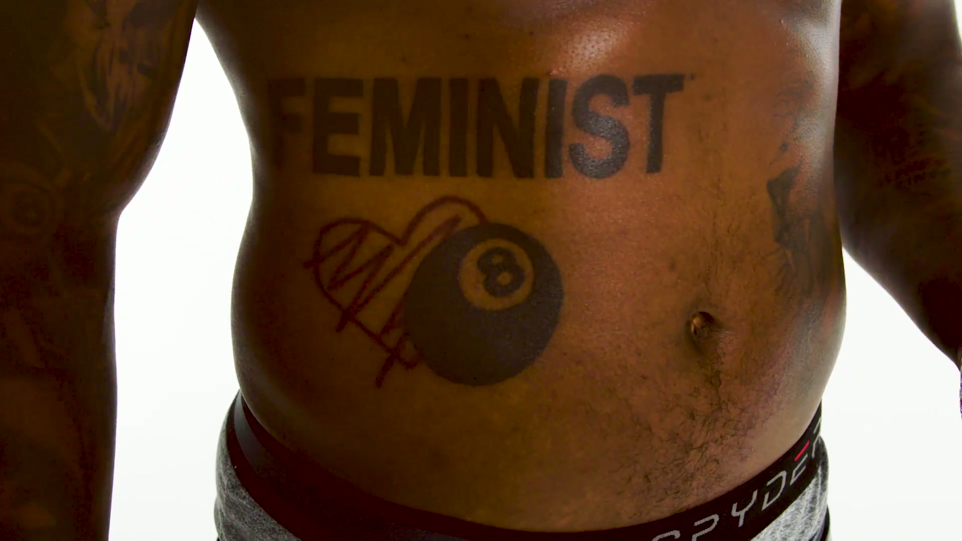 The FEMINIST and eight ball ribcage tattoo
