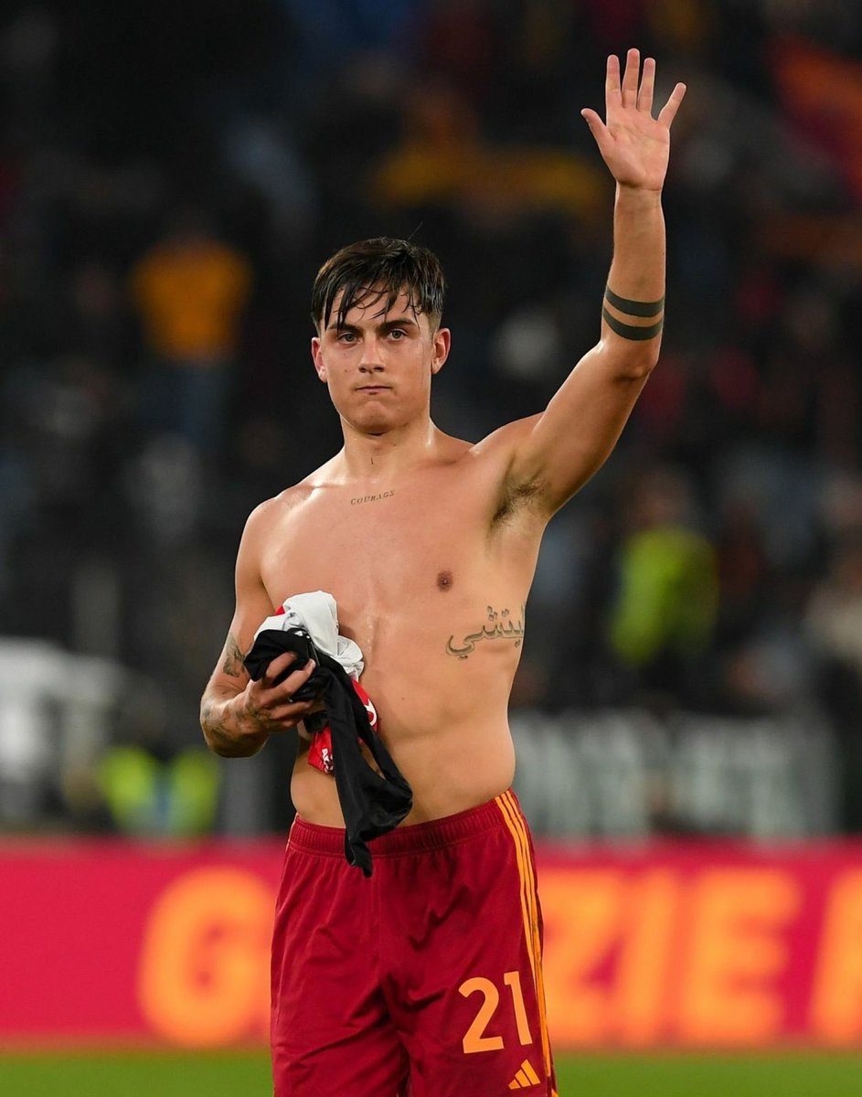 Paulo Dybala tattoos: clear front-facing celebration shot showing the chest word, butterfly and side script tattoos