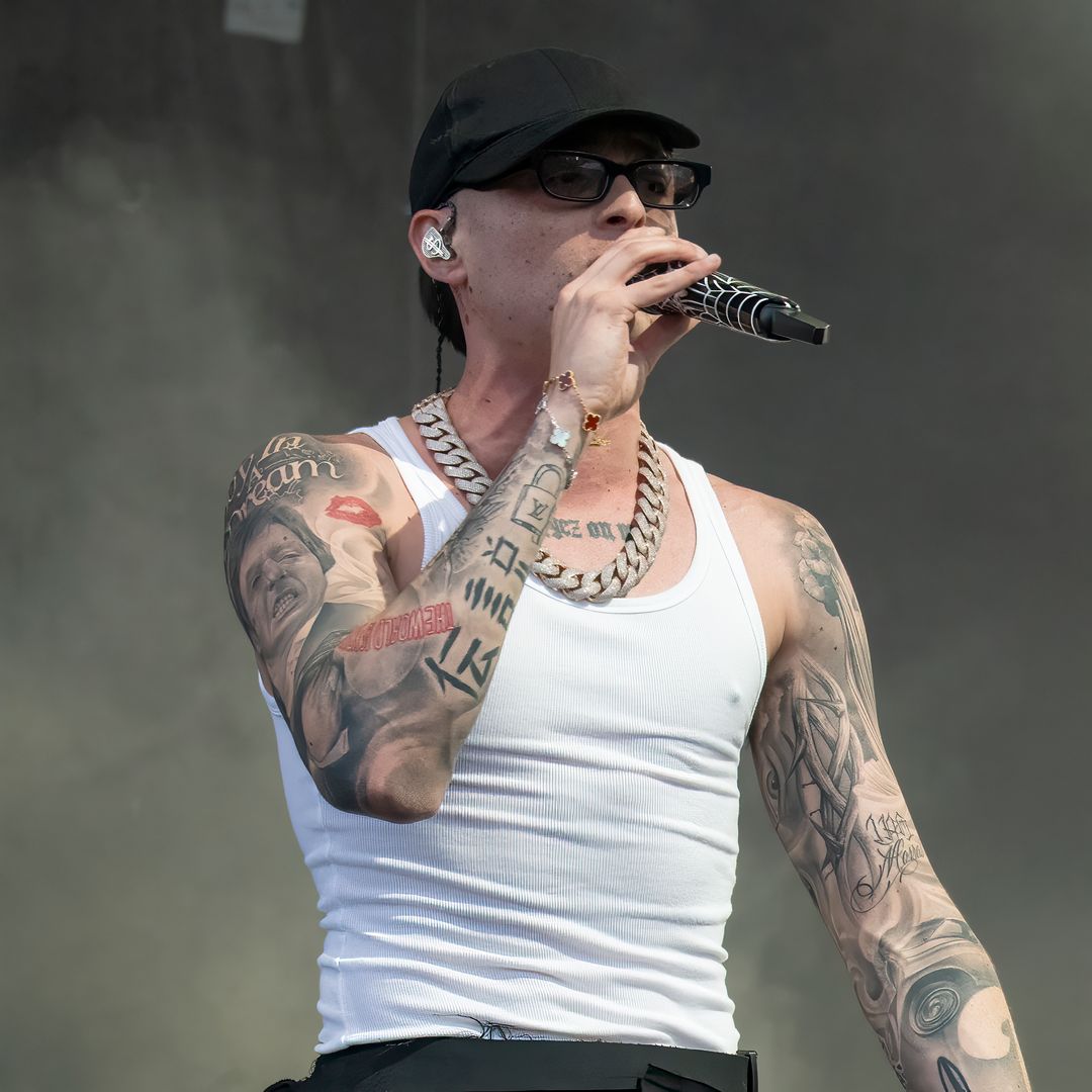 Peso Pluma live performance arm tattoos