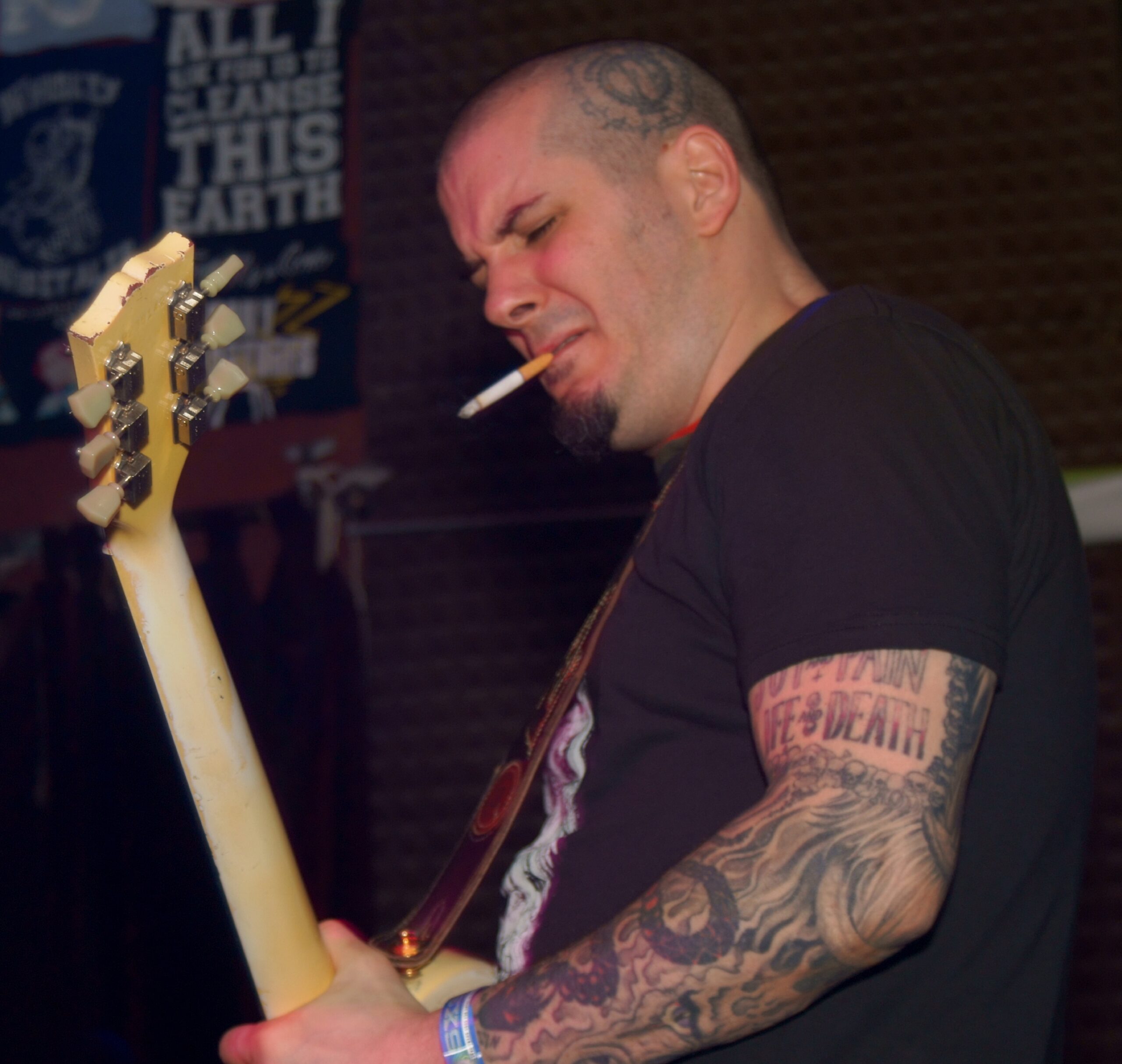 Phil Anselmo upper arm and head tattoo