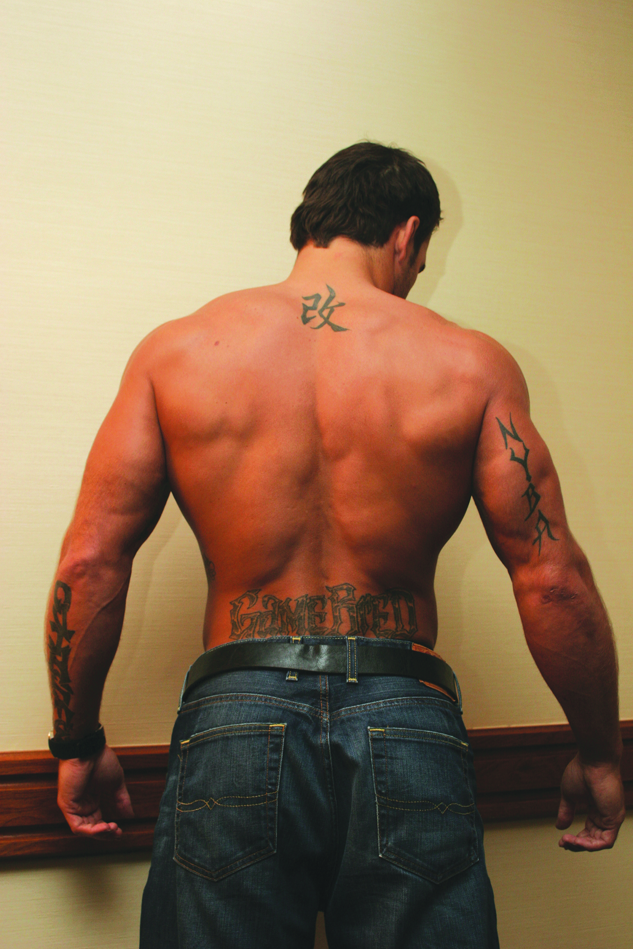 Phil Baroni tattoos: Change symbol tattoo on his upper back