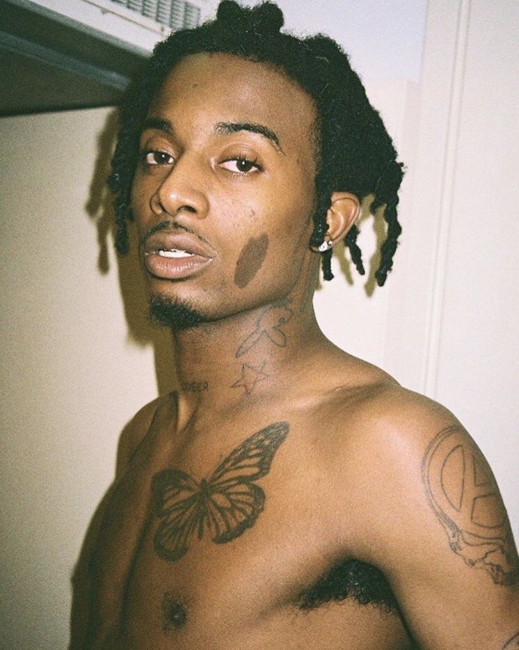 Playboi Carti butterfly and arm tattoos