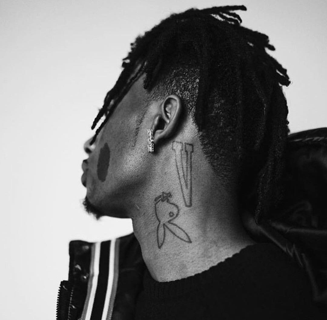 Playboi Carti neck V and bunny tattoos