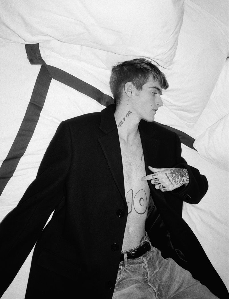 Presley Gerber tattoos: neck script, torso symbols, and hand tattoos