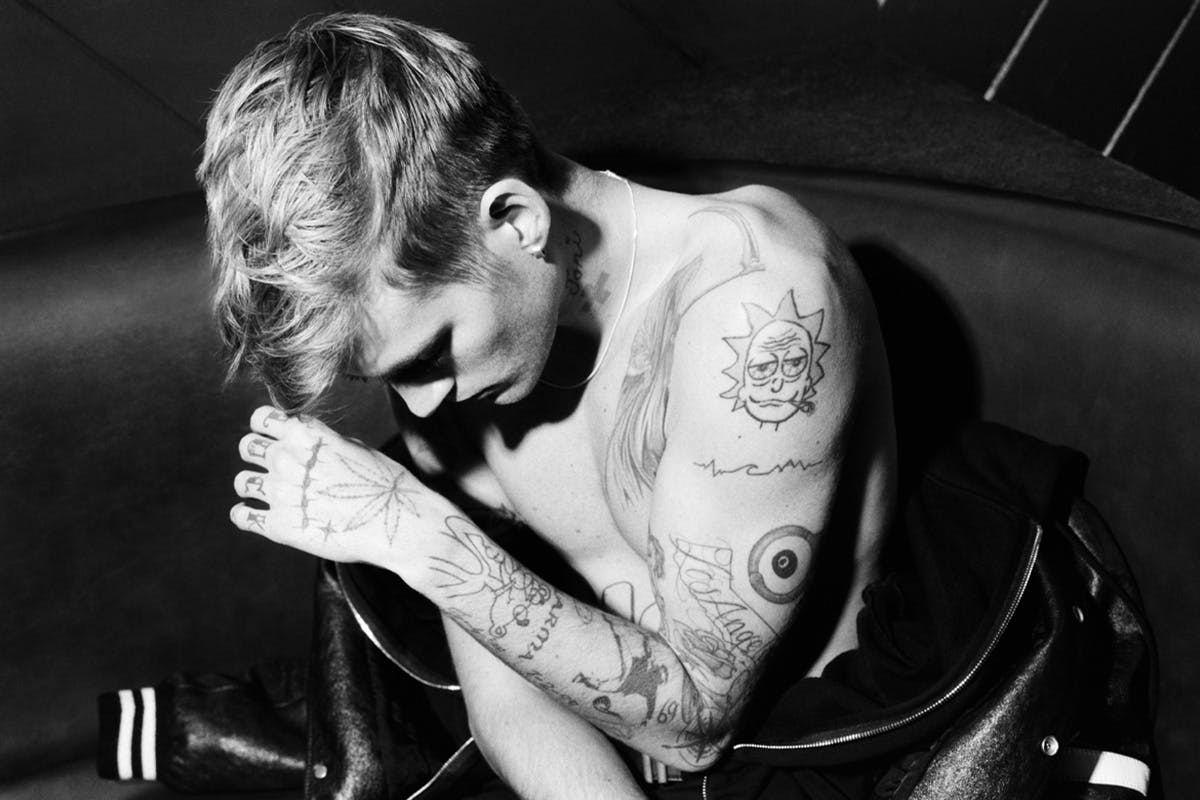 Presley Gerber tattoos: shoulder cartoon, arm lines, and forearm tattoos