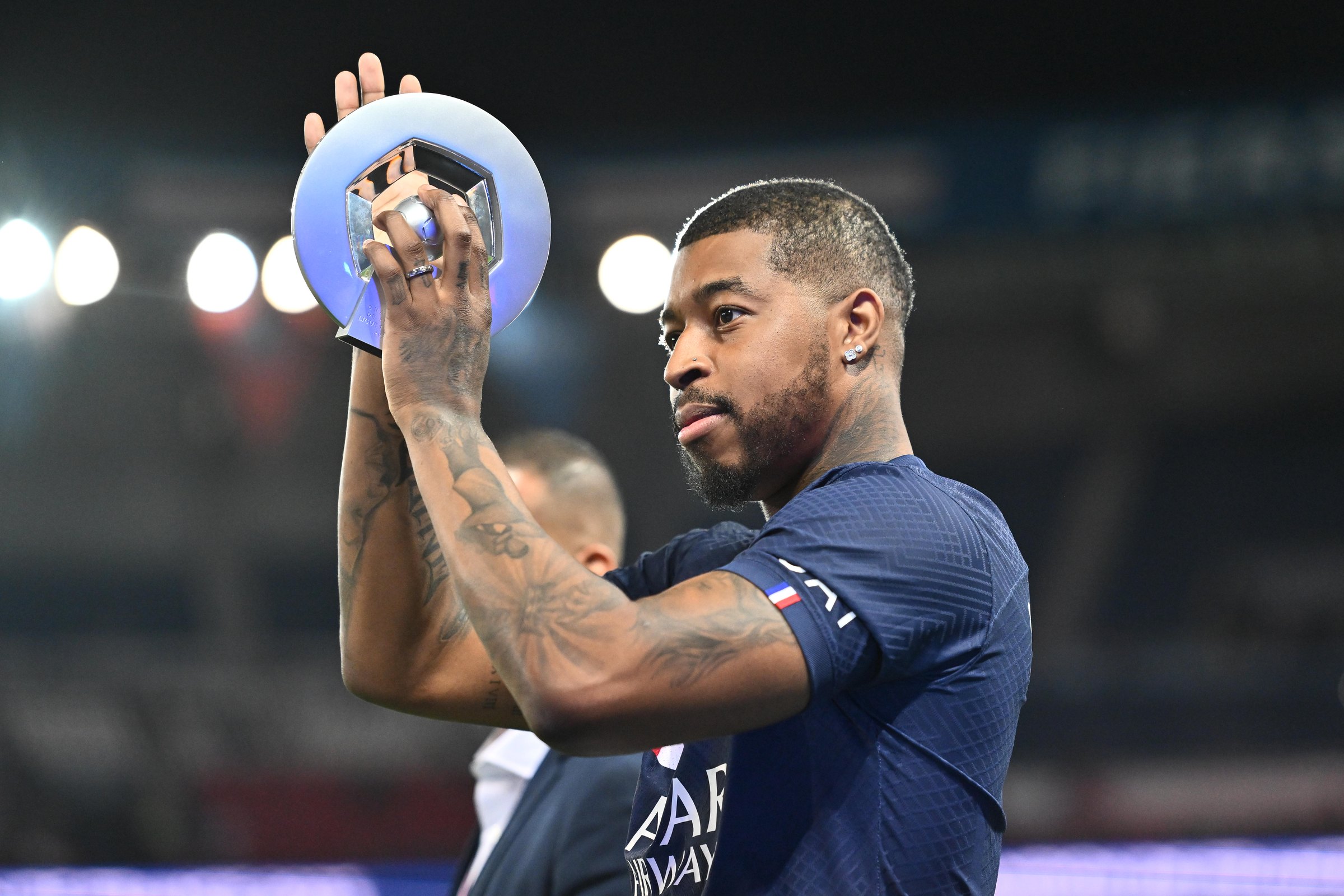 Presnel Kimpembe tattoos: High-resolution match photograph showing Kimpembe’s face, neck and both tattooed arms