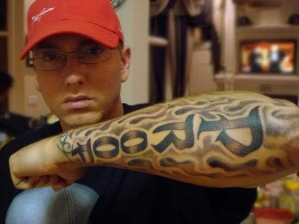 Eminem Proof tribute arm tattoo