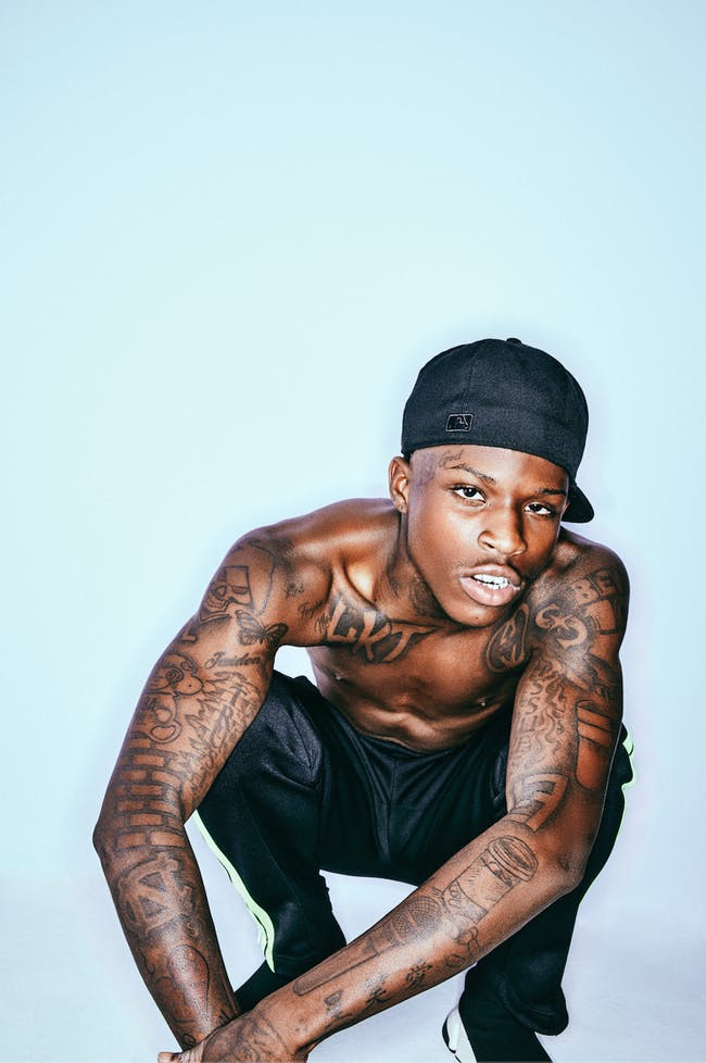 Quando Rondo tattoos: GET $ FUC LOVE chest lettering