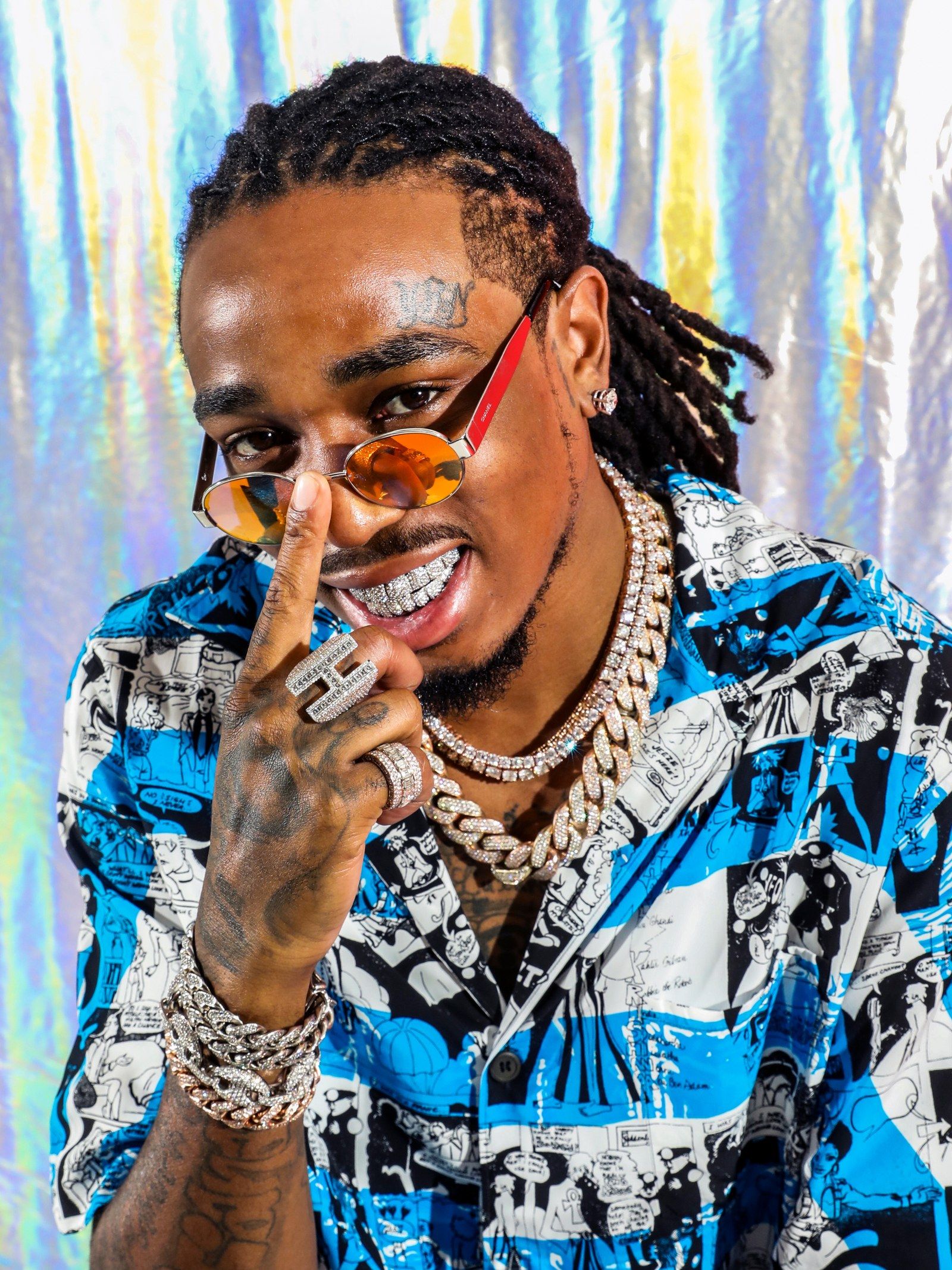 Quavo face and hand tattoos