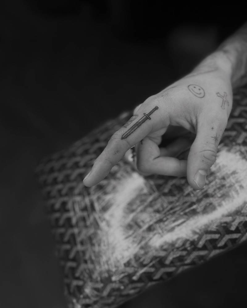 Romeo Beckham finger and hand tattoos