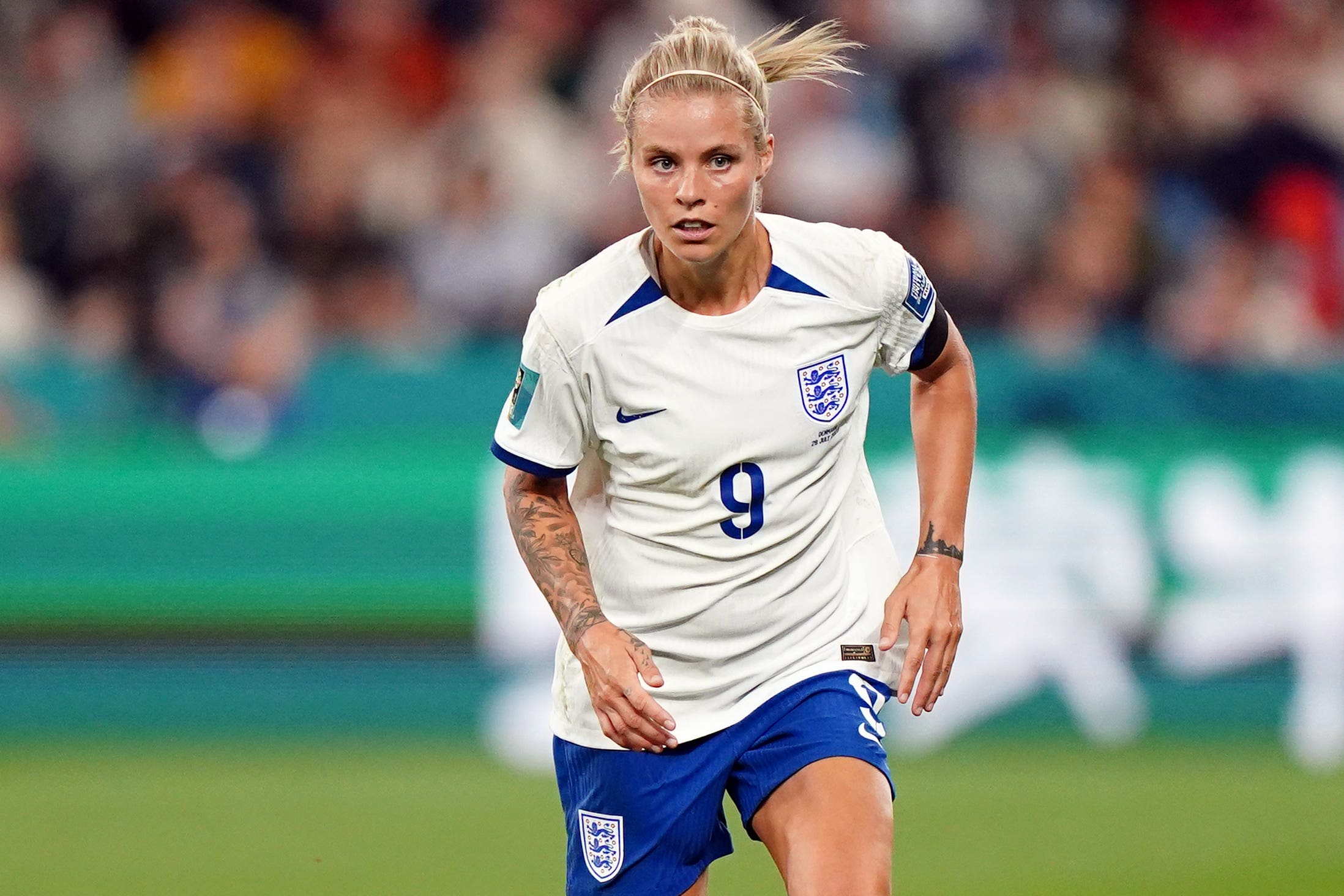 Rachel Daly tattoos: the forearm tattoo visible as she moves in an England shirt