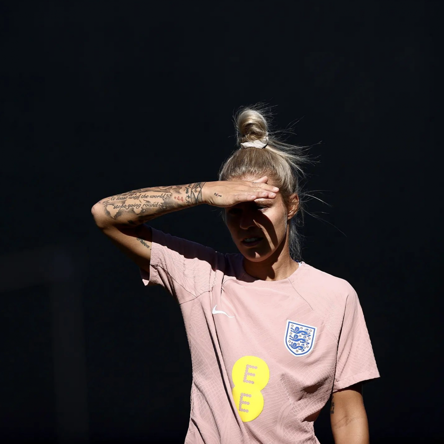 Rachel Daly tattoos: the script, small symbols, and wrist details in a close view