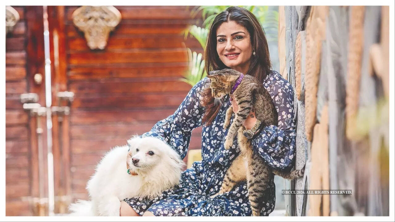 Raveena Tandon in a contextual photograph: Context for Raveena’s love of animals; not tattoo evidence; not tattoo evidence