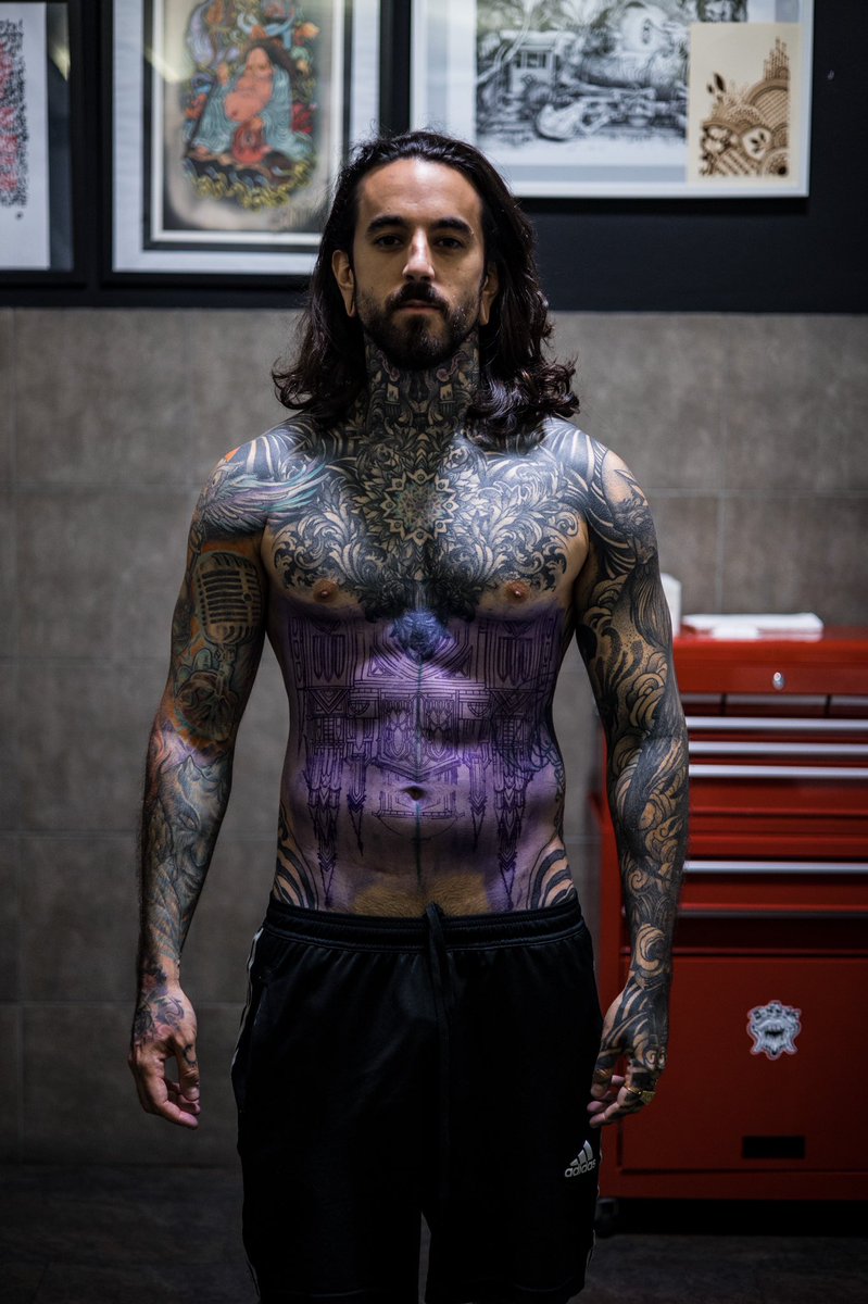 René ZZ chest, abdomen, and arm tattoos: verified studio photograph