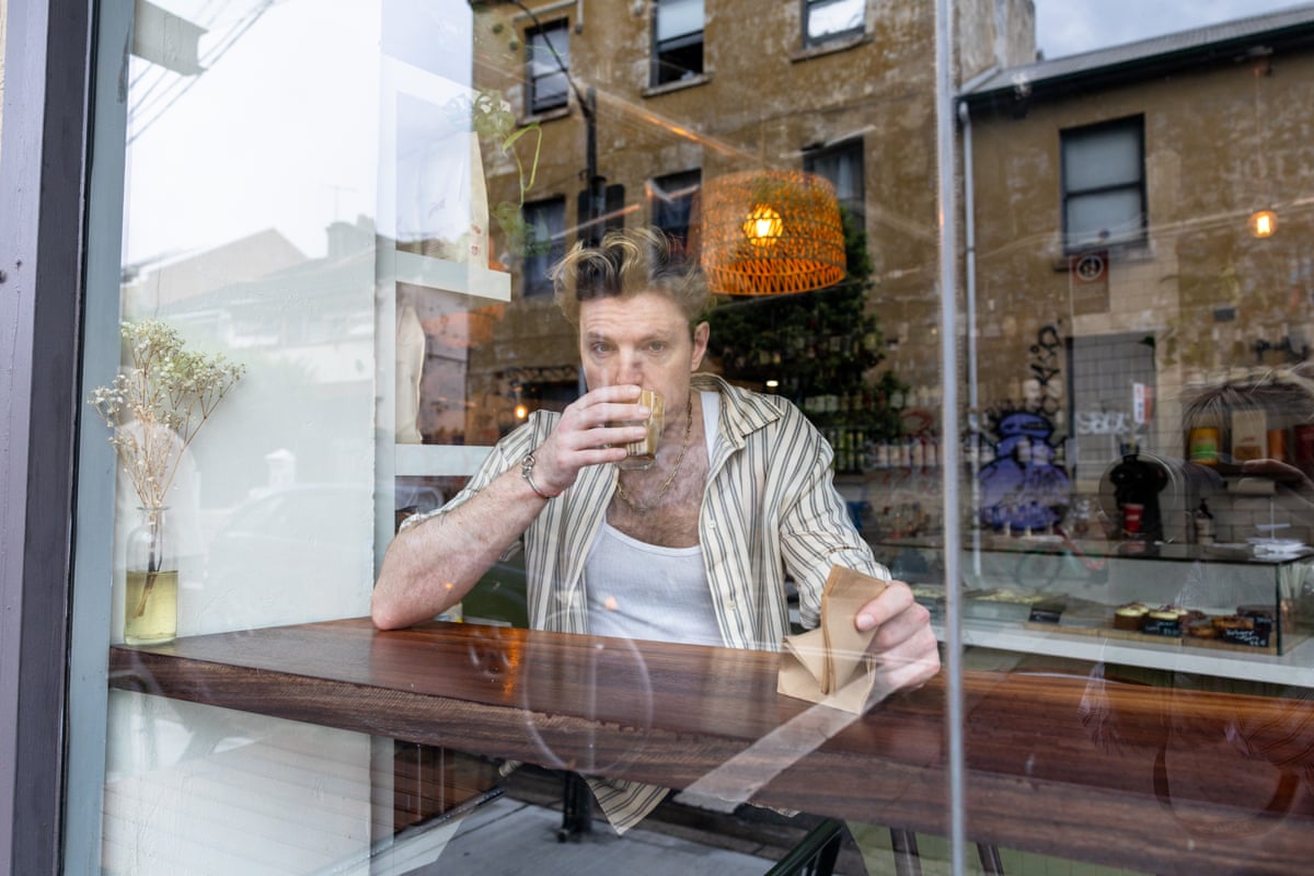 Reuben Kaye offstage cafe portrait Reuben Kaye in a contextual photograph: offstage cafe portrait context; not tattoo evidence