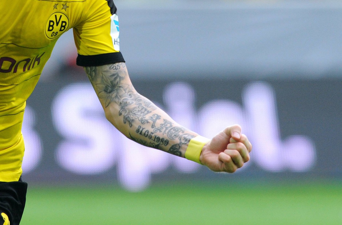 Marco Reus forearm tattoo with name and birth date