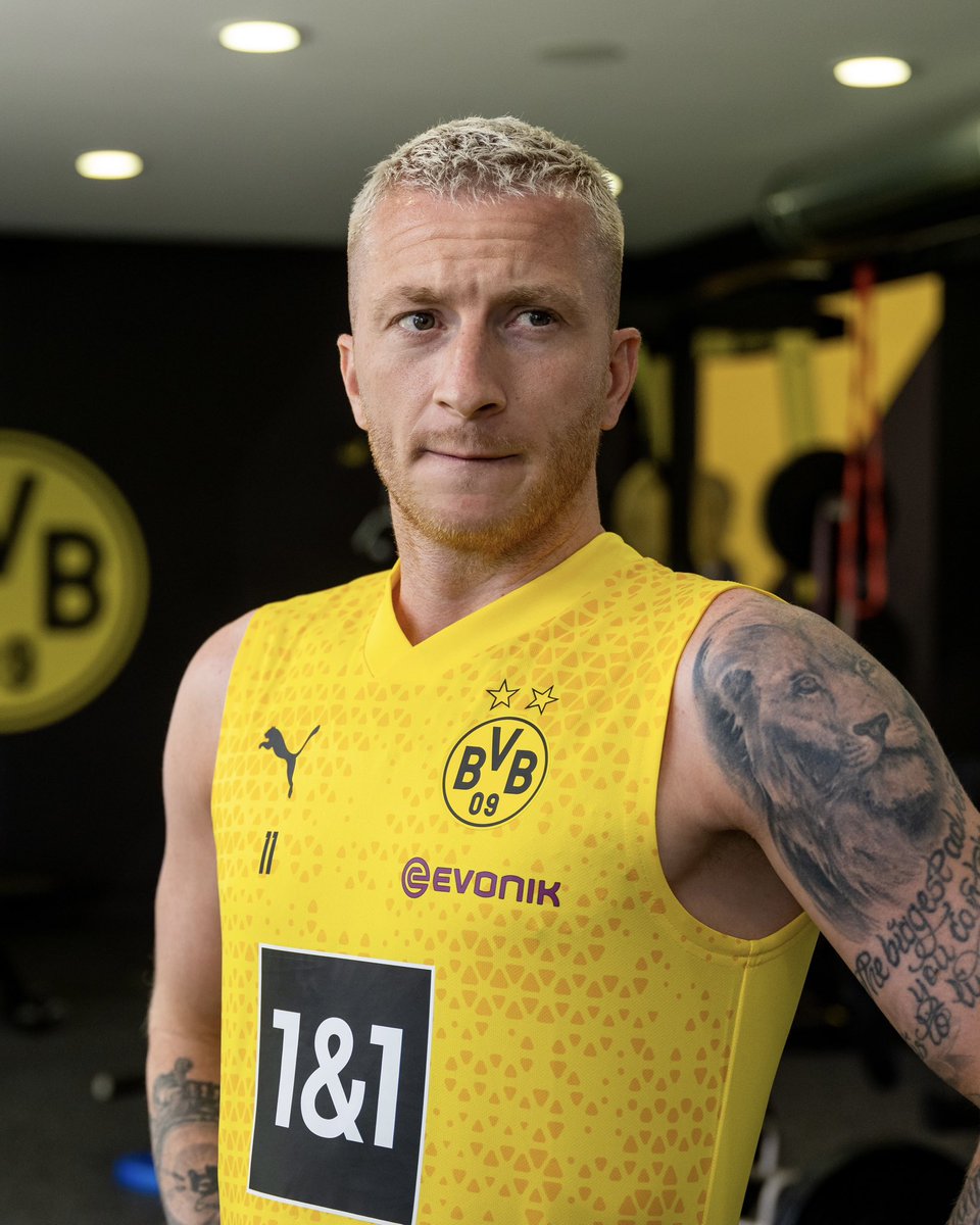 Marco Reus lion tattoo and script on his arm at training