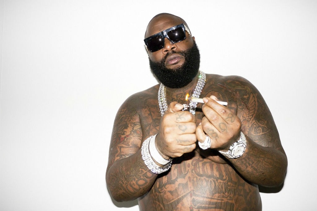 Rick Ross hand and forearm tattoos