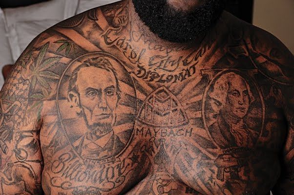Rick Ross chest tattoos with portraits